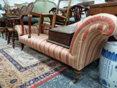 A VICTORIAN CHAISE LONGUE UPHOLSTERED IN TERRACOTTA STRIPED MATERIAL ON TURNED MAHOGANY LEGS WITH