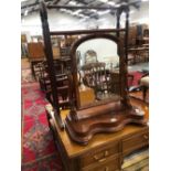 A ROUND ARCH DRESSING TABLE MIRROR IN A MAHOGANY FRAME TOGETHER WITH A MAHOGANY TOWEL RAIL