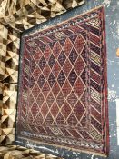 A ORIENTAL TRIBAL RUG. 138 x 123cms