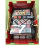 A QUANTITY OF ALL WORLD STAMPS ON SMALL STOCK CARDS.