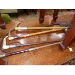 FOUR ANTIQUE RIDING CROPS INC. SILVER MOUNTED EXAMPLE.