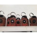 SEVEN RED PAINTED RAILWAY LANTERNS