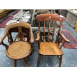 AN EARLY 20th C. MAHOGANY DESK ELBOW CHAIR WITH A CANED SEAT AND ROTATING ON FOUR LEGS TOGETHER WITH