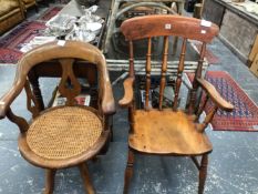 AN EARLY 20th C. MAHOGANY DESK ELBOW CHAIR WITH A CANED SEAT AND ROTATING ON FOUR LEGS TOGETHER WITH
