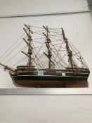 A MODEL THREE MASTED SHIP WITH ROPE RIGGING