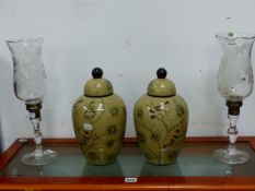 A PAIR OF STUART CRYSTAL FLORAL CUT GLASS VASES ON CANDLESTICK BASES TOGETHER WITH A PAIR OF COVERED