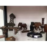 A PAIR OF TURKISH HAMMAM SHOES, CARVED WOOD ANIMALS, A PEN STAND AND A WATCH STAND