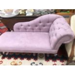 A MAHOGANY CHAISE LONGUE BUTTON UPHOLSTERED IN MAUVE SUEDE, THE CABRIOLE LEGS ON PAD FEET
