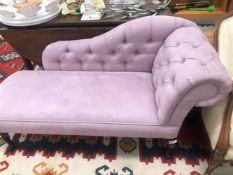 A MAHOGANY CHAISE LONGUE BUTTON UPHOLSTERED IN MAUVE SUEDE, THE CABRIOLE LEGS ON PAD FEET