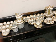 A LIMOGES PORCELAIN COFFEE SERVICE TOGETHER WITH ANOTHER LIMOGES SERVICE.