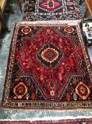 A PERSIAN SHIRAZ RUG. 154 x 126cms