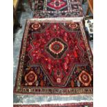 A PERSIAN SHIRAZ RUG. 154 x 126cms