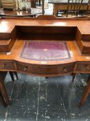A 20th C. YEW WOOD WRITING TABLE WITH TWO DRAWERS FLANKING THE LEATHER INSET TOP ABOVE A BOW FRONT