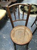 A SET OF FIVE BENTWOOD CHAIRS, ONE LABELLED FISCHEL, EACH WITH CANED CIRCULAR SEATS