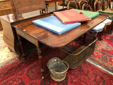 A 19th C. MAHOGANY DROP FLAP TABLE WITH A DRAWER TO ONE END ON TURNED CYLINDRICAL LEGS TAPERING TO