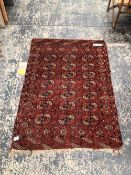 AN ANTIQUE TEKKE BOKHARA RUG. 150 x 107cms