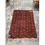 AN ANTIQUE TEKKE BOKHARA RUG. 150 x 107cms