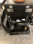 AN ELECTRIC SINGER SEWING MACHINE