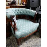 A VICTORIAN ROSEWOOD ARMCHAIR, THE BUTTON UPHOLSTERED TOP RAIL SUPPORTED ON A BALUSTRADE, THE TURNED