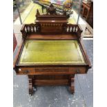 AN ARTS AND CRAFTS MAHOGANY DAVENPORT DESK, THE GREEN LEATHER INSET WRITING SURFACE ABOVE A