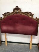 A MAHOGANY DOUBLE BED HEAD CARVED WITH ROCAILLE AND SCROLLING LEAVES ABOUT BUTTONED PURPLE VELVET. W