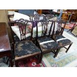 A SET OF SIX GEORGE III MAHOGANY CHAIRS, EACH WITH A GOTHIC TOP TO A THREE BAR SPLAT ABOVE AND
