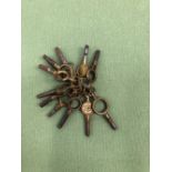 A SMALL COLLECTION OF ANTIQUE POCKET WATCH KEYS.