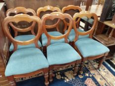 A SET OF SIX VICTORIAN MAHOGANY BALLOON BACKED CHAIRS