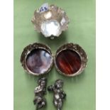 A PAIR OF ANTIQUE SILVER PLATED PUTTI, TWO WINE COASTERS, AND A SUGAR BOWL.