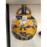 A CHINESE TWO HANDLED MOON FLASK PAINTED IN BLUE WITH DANCING FIGURES ON A OVERGLAZE YELLOW