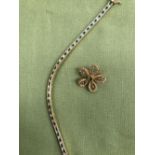 A 14ct GOLD EMERALD AND DIAMOND LINE BRACELET TOGETHER WITH A 9ct GOLD EMERALD AND SEED PEARL BROOCH