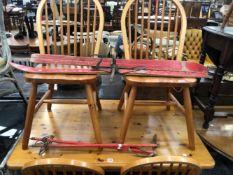 A PINE KITCHEN TABLE TOGETHER WITH FOUR CHAIRS, A PAIR OF CHILDS SKIS AND SKI STICKS. H 76cms W