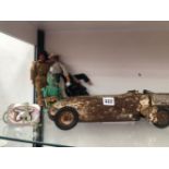 A MODEL LAND SPEED RECORD CAR, THREE ACTION MEN, ANOTHER TOY AND A BELT WITH CROSSED PISTOLS BUCKLE