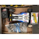 TWO TAMIYA OFF ROAD RACING CARS TOGETHER WITH A FUTABA FP-T2NCR BIONIC GOLD REMOTE
