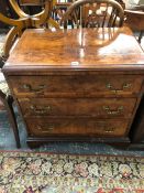 A VICTORIAN CROSS BANDED BURR WALNUT CHEST OF THREE LONG DRAWERS ON BRACKET FEET, THE TOP QUARTER