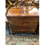 A VICTORIAN CROSS BANDED BURR WALNUT CHEST OF THREE LONG DRAWERS ON BRACKET FEET, THE TOP QUARTER