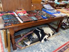 A 19th C. OAK REFECTORY TABLE ON GUN BARREL LEGS JOINED AT THE SQUARE SECTIONED FEET BY