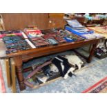 A 19th C. OAK REFECTORY TABLE ON GUN BARREL LEGS JOINED AT THE SQUARE SECTIONED FEET BY