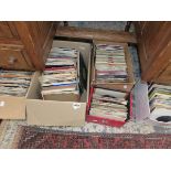 A LARGE COLLECTION OF VINTAGE RECORD 7" SINGLES.