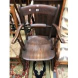 AN OXFORD TYPE ELBOW CHAIR WITH SADDLE SEAT AND TURNED FRONT LEGS