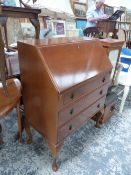 A 20th C. MAHOGANY BUREAU WITH THREE DRAWERS BELOW THE FALL