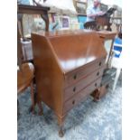 A 20th C. MAHOGANY BUREAU WITH THREE DRAWERS BELOW THE FALL