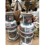 A PAIR OF CANTON VASE/LAMPS, A SATSUMA JAR/LAMP, THREE FIGURAL LAMPS AND ANOTHER SUPPORTED BY AN