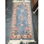 TWO CHINESE RUGS. 170 x 77cms (2)