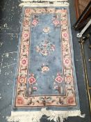 TWO CHINESE RUGS. 170 x 77cms (2)