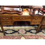 A 20th C. MAHOGANY TABLE WITH A CONFIGURATION OF FIVE DRAWERS, THE SQUARE LEGS TAPERING TO CERAMIC