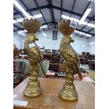 A PAIR OF PARROT GILDED CANDLESTICKS.