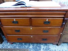 A VICTORIAN MAHOGANY CHEST OF TWO SHORT AND TWO LONG DRAWERS ON BUN FEET. W 135 x D 57 x H 100cms.