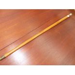 AN ANTIQUE SILVER MOUNTED MALLACCA WALKING CANE.