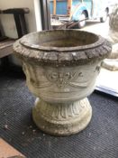 A LARGE COMPOSITE CLASSICAL STYLE URN ON STAND